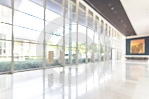 Blur office or hotel lobby background interior view toward reception hall, modern luxury white room space with blurry corridor