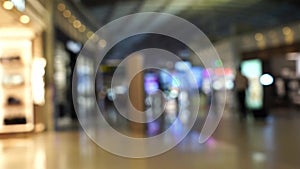 Blur of passenger moving in duty free shop