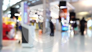 Blur of passenger moving in duty free shop