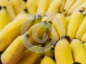 Blur picture of close up yellow bananas on the table