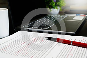 Blur proofreading sheet on table