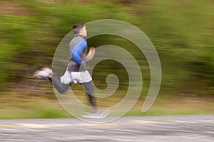 Blur, runner and man running in nature training, cardio exercise and workout for sports or speed. Fast motion, fitness