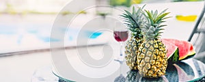 Blur shallow depth of field of tropical fruits with welcome drinks at pool wide banner for hotel tourist travel holiday summer