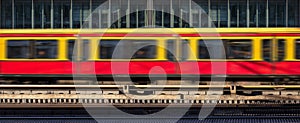 Blur train in motion, office building background