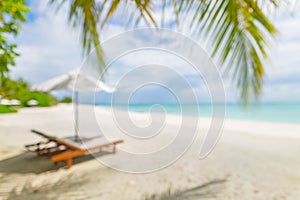 Blur of tranquil beach scene. Blurry exotic tropical beach landscape for background wallpaper. Design of summer vacation holiday