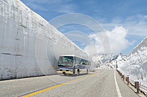 Blur windshield bus move along snow wall at tateyama kurobe alpine route