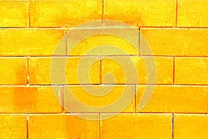 Blured background of golden brick wall