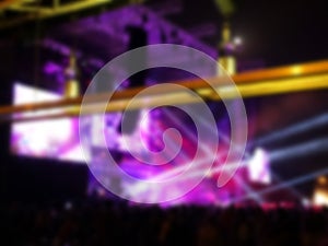 Blurred abstract background. Bokeh lighting in concert with audience.