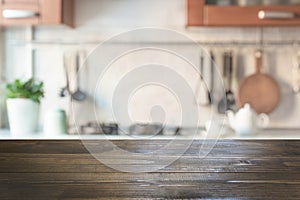 Blurred abstract background. Modern kitchen with tabletop and space for display your products. photo