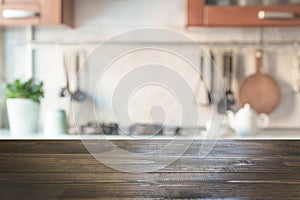 Blurred abstract background. Modern kitchen with tabletop and space for display your products.