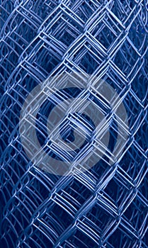 Blurred abstract background. Texture of a mesh netting roll.