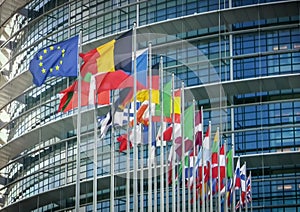 Blurred - Abstract, defocused photo, for background. Many flags of different countries of the world.