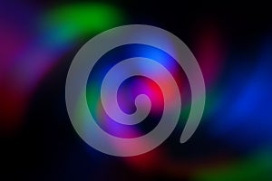 Blurred abstract gradient wave green, pink, blue, blurry christmas and holiday lights background. Multicolored, bright spiral