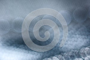 Blurred abstract gray and blue background with bokeh