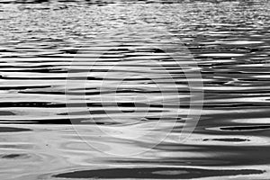 Blurred abstracted water surface in black and white mode with selective focus