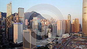 Blurred all visible brands and logos. Aerial view of Hong Kong city at early morning time.