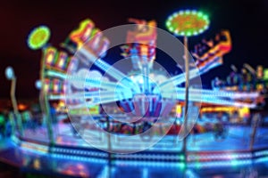 Blurred Amusement park ride at night. conceptual image of entertainment & fun