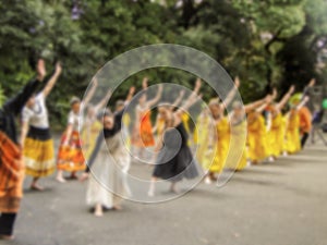 Blurred asain women group with hawaiian costume style and dancing hula show at outdoor street background