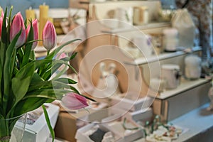 blurred backdrop of a beautiful market stall filled with handcrafted items at a seasonal fair. Springtime events and