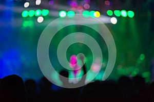 Blurred background : Bokeh lighting in outdoor concert with cheering audience