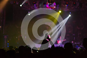 Blurred background : Bokeh lighting in outdoor concert with cheering audience