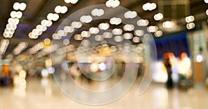 Blurred background bright shopping mall Silver gray lighting. defocused store light bokeh in retail store. Blurry hospital bright