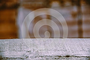 Blurred background of carpentry workshop. Table scratched table top. Copy space