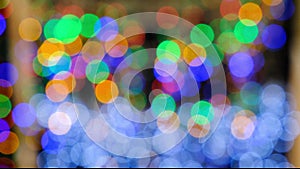 Blurred background of colorful flashing lights. Rodzhestven and New Year's decorative spots. Color muzika. Rainbow rain