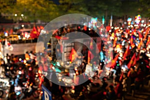 Blurred background of crowd of Vietnamese football fans down the street to celebrate the win after soccer, with a lot of