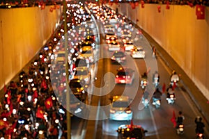 Blurred background of crowd of Vietnamese football fans down the street to celebrate the win after soccer, with a lot of