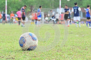 Blurred background kid soccer player in academy