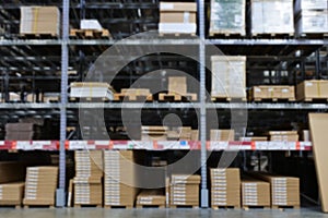 Many items inside cardboard boxes on warehouse storage shelves