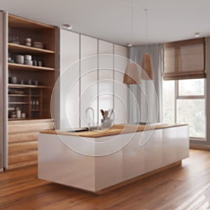 Blurred background, minimalist contemporary wooden kitchen with island. Parquet floor and panoramic window with curtains. Modern