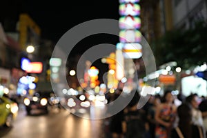 Blurred background night city street, carriageway, car lights. Travel concept: Bokeh light