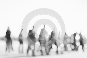 Blurred background of people activities in park with bokeh, spring and summer season. Blurred people near lake. Black and white