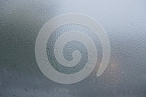 Blurred background when see through car windshield with full droplets