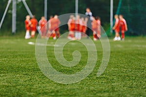 Blurred Background of Sports Team with Coach on Training Field. Soccer Summer Training Camp