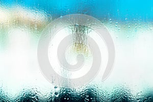 Blurred background of water droplets on glass, background photo of increased condensation