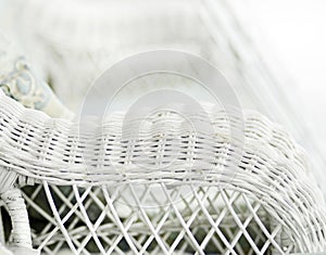 Blurred background white nostalgic vintage wicker chair photo