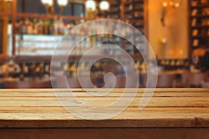 Blurred bar interior and wooden counter