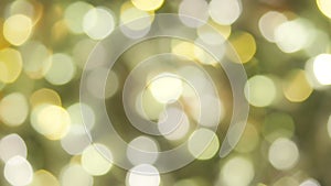 Blurred bokeh christmas glowing golden background. Christmas lights. Gold holiday new year abstract glitter defocused