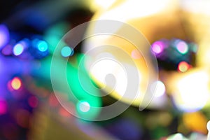 Blurred bokeh defocused colorful lights of computer. Abstract beautiful background on dark