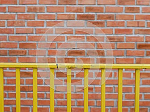 Blurred of brown brick block wall background with dirty and yell