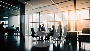 Blurred business people in glass office. business people in modern office. group of business people sitting around table and