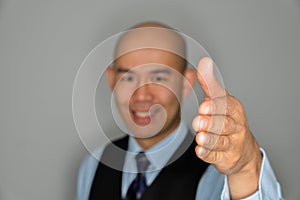 Blurred Businessman Offering Clear Handshake And Smile