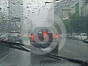 Blurred car on road in raining, driver view