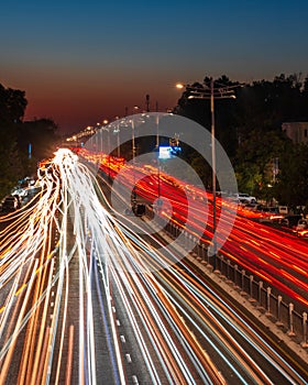 Blurred car traffic light at night city. Traffic jam in evening rush hour.