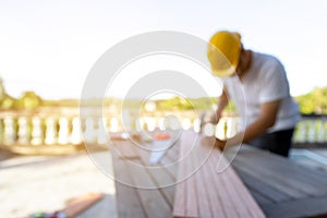 Blurred  carpenter man standing and working