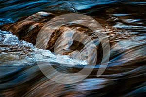 Blurred cascades on the autumn river