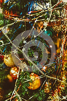 Blurred Christmas background with Christmas tree, decorations and tinsel